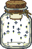 A glass jar full of fireflies